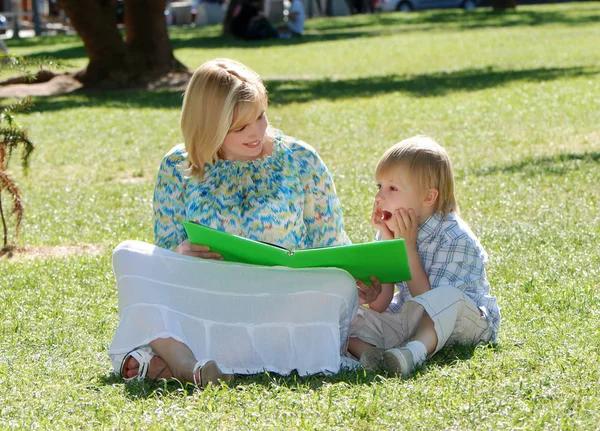 Mother Son Reading Book Together Lawn Park — Stockfoto