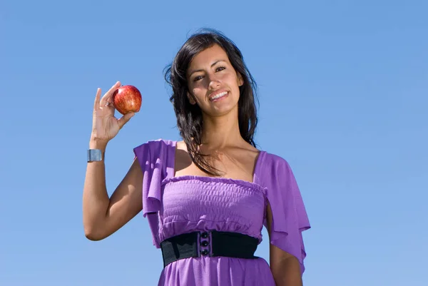 Beautiful Young Woman Eating Apple Front Blue Sky — Φωτογραφία Αρχείου