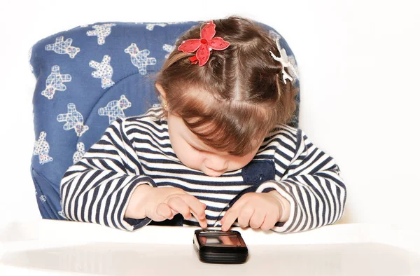 Retrato Niña Adorable Usando Teléfono Mientras Está Sentada Silla Aislada — Foto de Stock