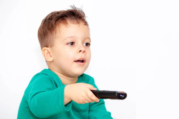 Emotionele Jongen Met Afstandsbediening Een Lichte Achtergrond — Stockfoto