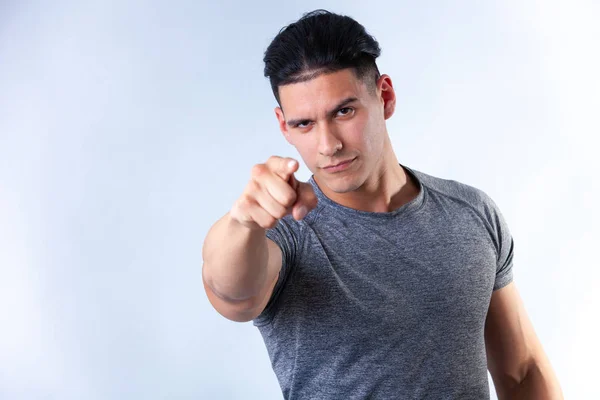 portrait of young attractive man on light background