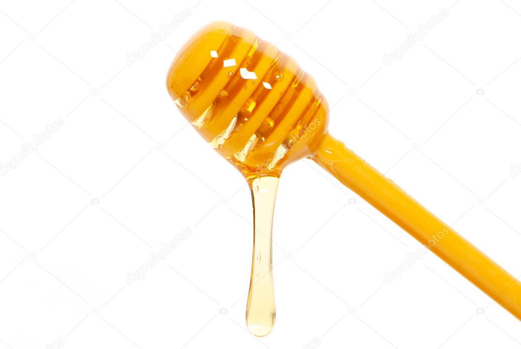 honey dipper with a drop of bee honey