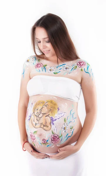 幸せな妊娠中の女性とともに美しいパターンの彼女の胃 — ストック写真