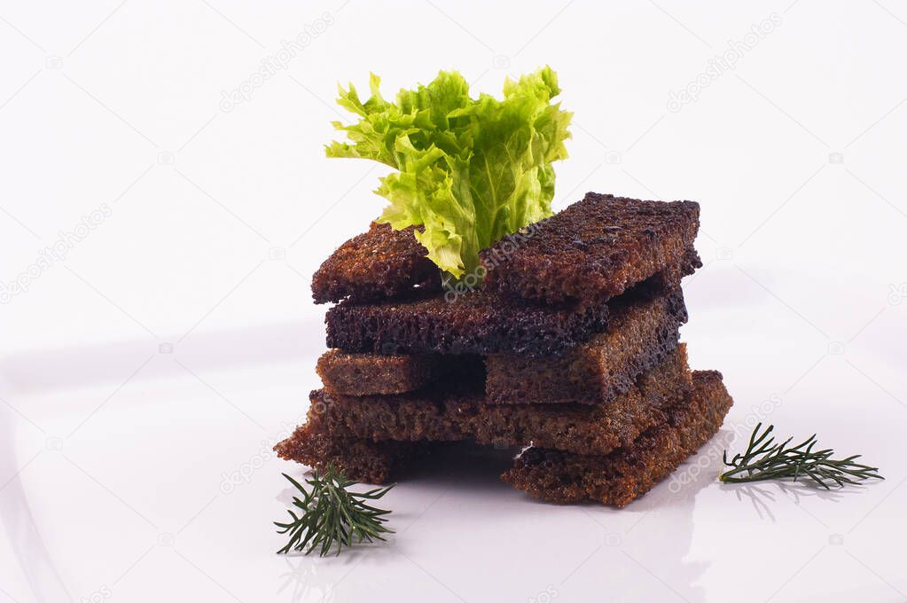 fried croaton on white plate with salad