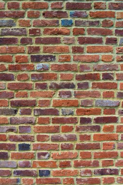 Bir sürü deseni ve rengi olan Eski Kırmızı Tuğla Duvar.