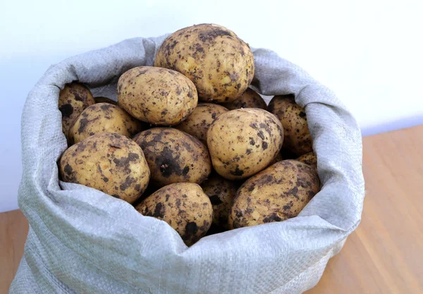 Fresh organic potatoes in a bag