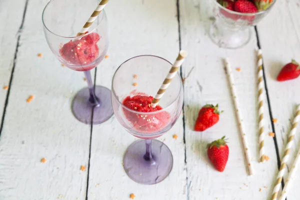 Two wineglasses with strawberry sorbet