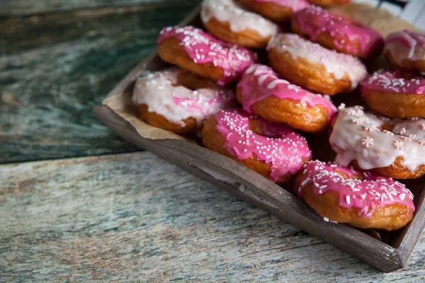 Sweet and colourful donuts with sprinkles and frosting — 图库照片
