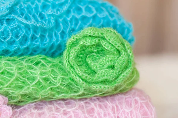 Stack of various knit mini blankets with headbands — Stock Photo, Image