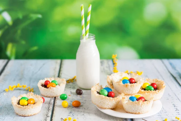 Coconut nests filled with Easter eggs — Stock Photo, Image
