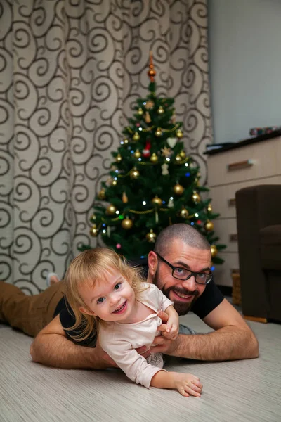Having fun near Christmas tree — Stock Photo, Image
