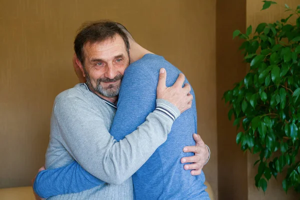 Pensive Senior Man Hugging His Adult Son Father Day Concept — Stock Photo, Image