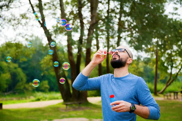 Bearded Man Blowing Soap Bubbles Park Summer Enjoying Life Freedom — Stock Photo, Image