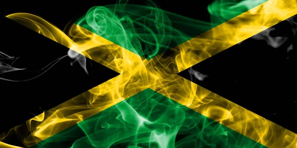黒の背景に煙ジャマイカ国旗 — ストック写真
