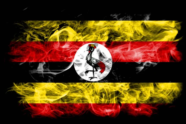 黒の背景に煙のウガンダの国旗 — ストック写真