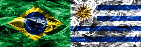 Бразилия Уругвай Флаги Дыма Помещены Бок Бок — стоковое фото
