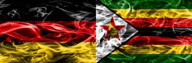 Almanya vs Zimbabve duman bayrakları yan yana yerleştirilmiş. Almanca ve Zimbabve bayrağı birlikte