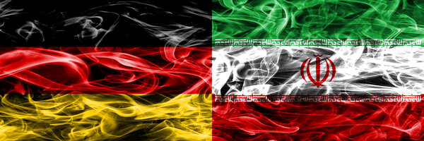 Germany vs Iran smoke flags placed side by side. German and Iran flag together