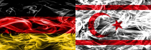 Germany vs Northern Cyprus smoke flags placed side by side. German and Northern Cyprus flag together