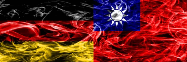Germany vs Taiwan smoke flags placed side by side. German and Taiwan flag together