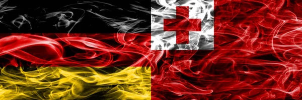 Germany vs Tonga smoke flags placed side by side. German and Tonga flag together