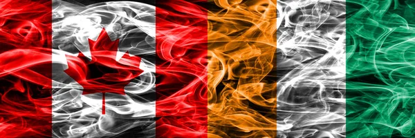 Канада Проти Кот Івуару Дим Прапори Розміщені Поруч Канадський Кот — стокове фото