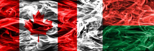 Canada Madagascar Rauchfahnen Nebeneinander Platziert Kanadische Und Madagaskar Flagge Gemeinsam — Stockfoto