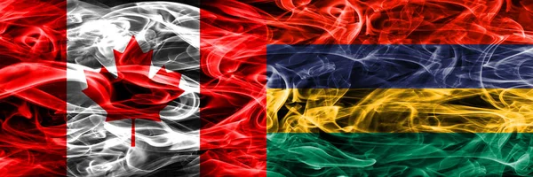 Канада Против Маврикия Дымовые Флаги Размещенные Бок Бок Флаг Канады — стоковое фото