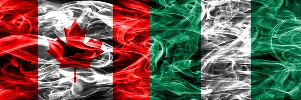 Канада Проти Нігерії Дим Прапори Розміщені Поруч Канадська Нігерії Прапор — стокове фото