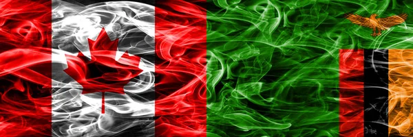 加拿大 赞比亚的烟雾旗并排放置 加拿大和赞比亚国旗一起 — 图库照片