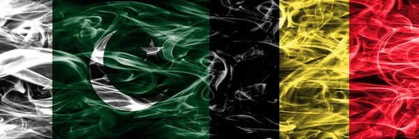 Pakistan vs Belgium smoke flags placed side by side. Thick colored silky smoke flags of Pakistan and Belgium