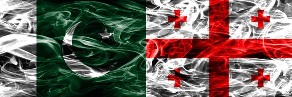 Пакистан Против Грузии Курит Флаги Размещенные Бок Бок Толстые Шёлковые — стоковое фото