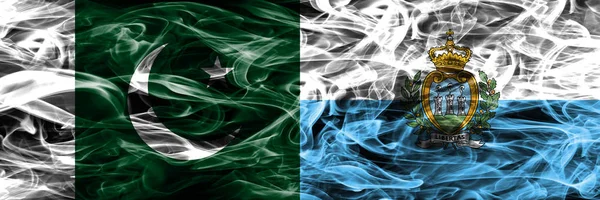 巴基斯坦 圣马力诺的烟雾旗并排放置 巴基斯坦和圣马力诺厚颜色的丝质烟雾旗 — 图库照片