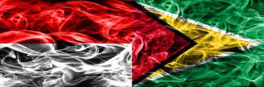 Endonezya rakip Guyana duman bayrakları yan yana yerleştirilmiş. Endonezya dili ve Guyana ipeksi duman bayrakları renkli kalın