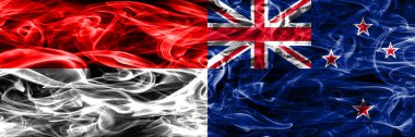 Endonezya rakip Yeni Zelanda bayrakları yan yana yerleştirilmiş duman. Endonezya dili ve Yeni Zelanda ipeksi duman bayrakları renkli kalın