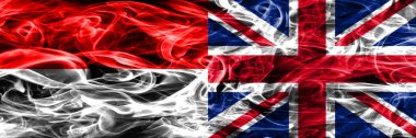 Endonezya vs duman İngiltere bayrakları yan yana yerleştirilmiş. Endonezya dili ve İngiltere ipeksi duman bayrakları renkli kalın