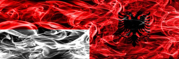 Индонезия Против Албании Дымовые Флаги Размещенные Бок Бок Толстые Шёлковые — стоковое фото