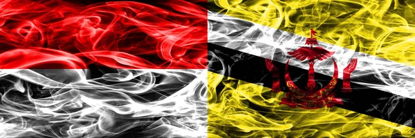 Индонезия Бруней Дым Флаги Помещены Бок Бок Толстые Цветные Шелковистые — стоковое фото