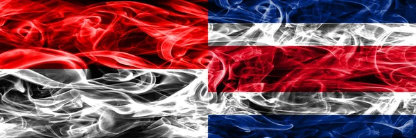 哥斯达黎加烟旗并排放置 印尼和哥斯达黎加厚颜色的丝质烟雾旗 — 图库照片