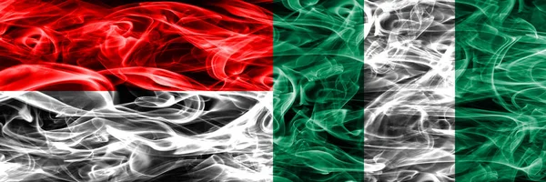 Indonesien Nigeria Rauchfahnen Nebeneinander Platziert Dicke Seidige Rauchfahnen Aus Indonesien — Stockfoto
