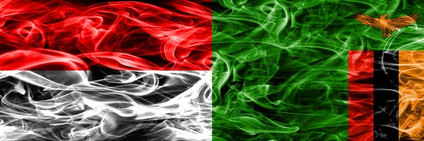 Индонезия Против Замбии Дымовые Флаги Размещенные Бок Бок Толстые Шёлковые — стоковое фото