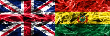 İngiltere vs Bolivya duman bayrakları yan yana yerleştirilmiş. Büyük Britanya ve Bolivya ipeksi duman bayrakları renkli kalın