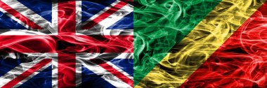 İngiltere vs Kongo duman bayrakları yan yana yerleştirilmiş. Büyük Britanya ve Kongo ipeksi duman bayrakları renkli kalın