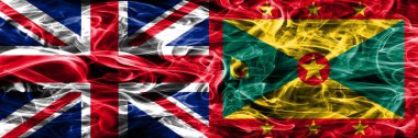 İngiltere vs Grenada duman bayrakları yan yana yerleştirilmiş. Büyük Britanya ve Grenada ipeksi duman bayrakları renkli kalın