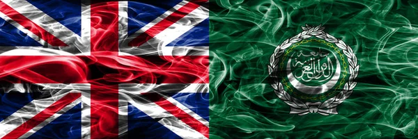 United Kingdom vs Arab League smoke flags placed side by side. Thick colored silky smoke flags of Great Britain and Arab League