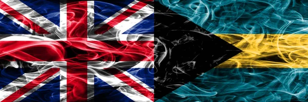巴哈马烟旗并排放置 英国和巴哈马厚颜色的丝质烟雾旗 — 图库照片