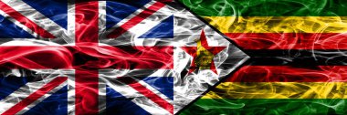 İngiltere vs Zimbabve duman bayrakları yan yana yerleştirilmiş. Büyük Britanya ve Zimbabve, ipeksi duman bayrakları renkli kalın