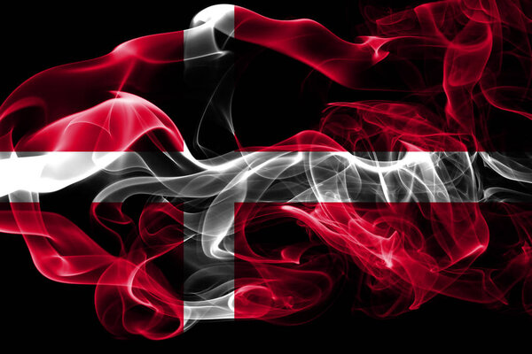 National flag of Denmark made from colored smoke isolated on black background. Abstract silky wave background.