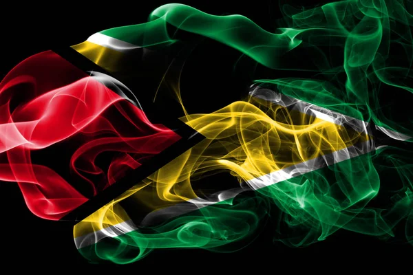 圭亚那国旗由黑色背景上的有色烟雾制成 抽象丝质波浪背景 — 图库照片