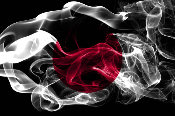 National flag of Japan made from colored smoke isolated on black background. Abstract silky wave background.